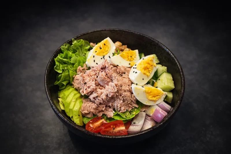 Tuna salad bowl with eggs and fresh vegetables